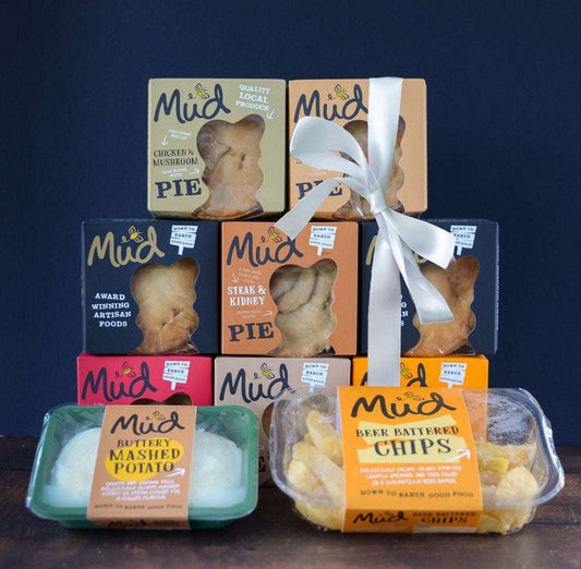 Mud Pies' The Complete Gift Box features six boxed pies in two neat rows with a white ribbon, plus creamy mash and beer-battered chips.