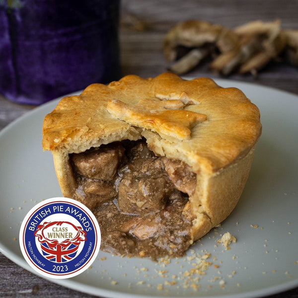 MudFoods game pie cut open on a plate