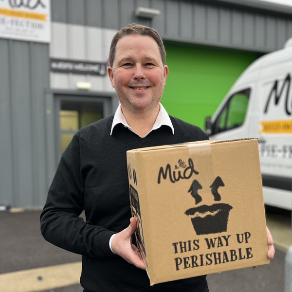 Christian ready with a box of pies at the new offices