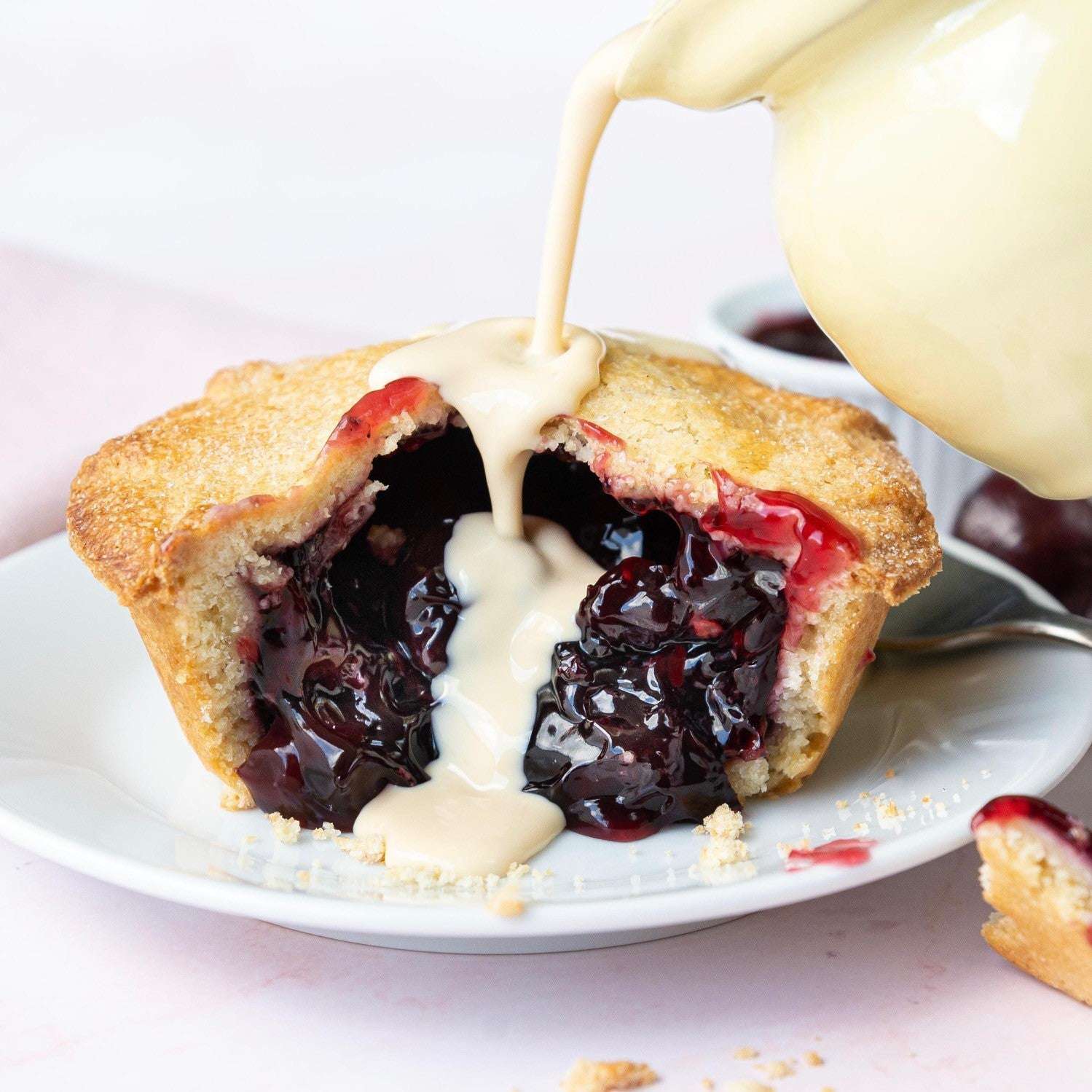 The Mud Pies Christmas Gift Box offers golden, flaky cherry pie with juicy filling and crumbly crust—a festive British treat.