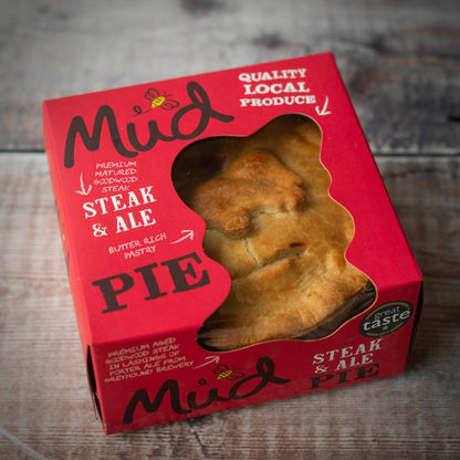 Luxury Christmas Collection Gift Box by Mud Pies, a red square box with window showing a golden steak and ale pie; festive treat.