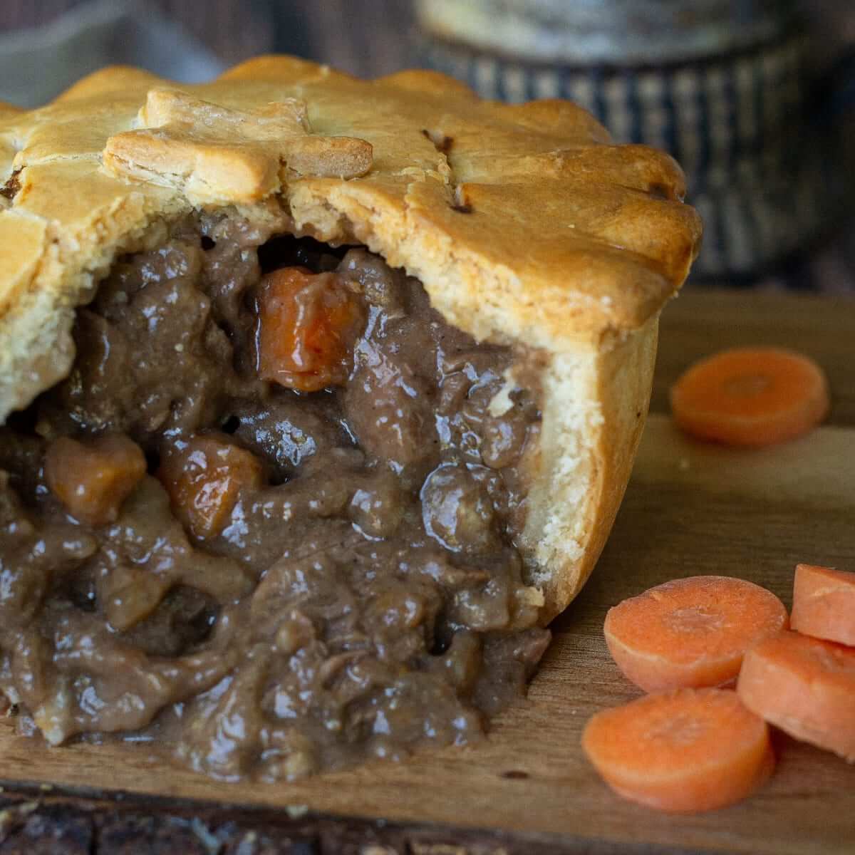 Delicious steak pie showing tender filling with carrots, part of the pie box for 8 collection.