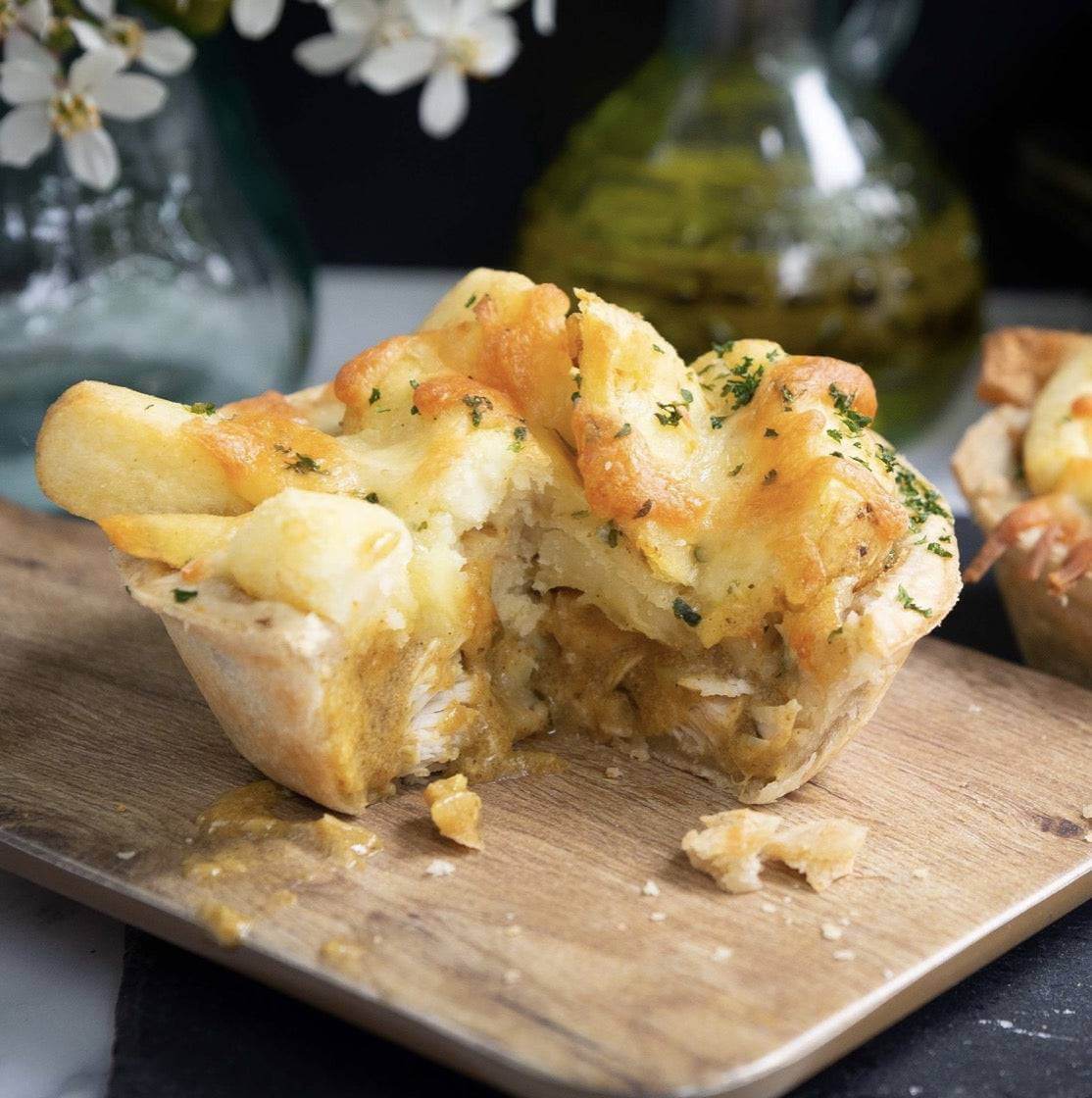 Mud Pies Chip Top Chicken Royale: a British free-range chicken pie with golden pastry, creamy sauce, tender pieces, and melted cheese.