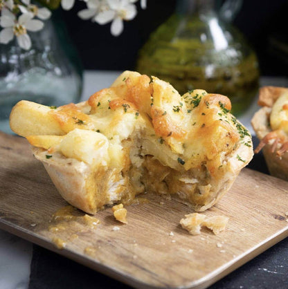 Mud Pies Chip Top Chicken Royale: a British free-range chicken pie with golden pastry, creamy sauce, tender pieces, and melted cheese.